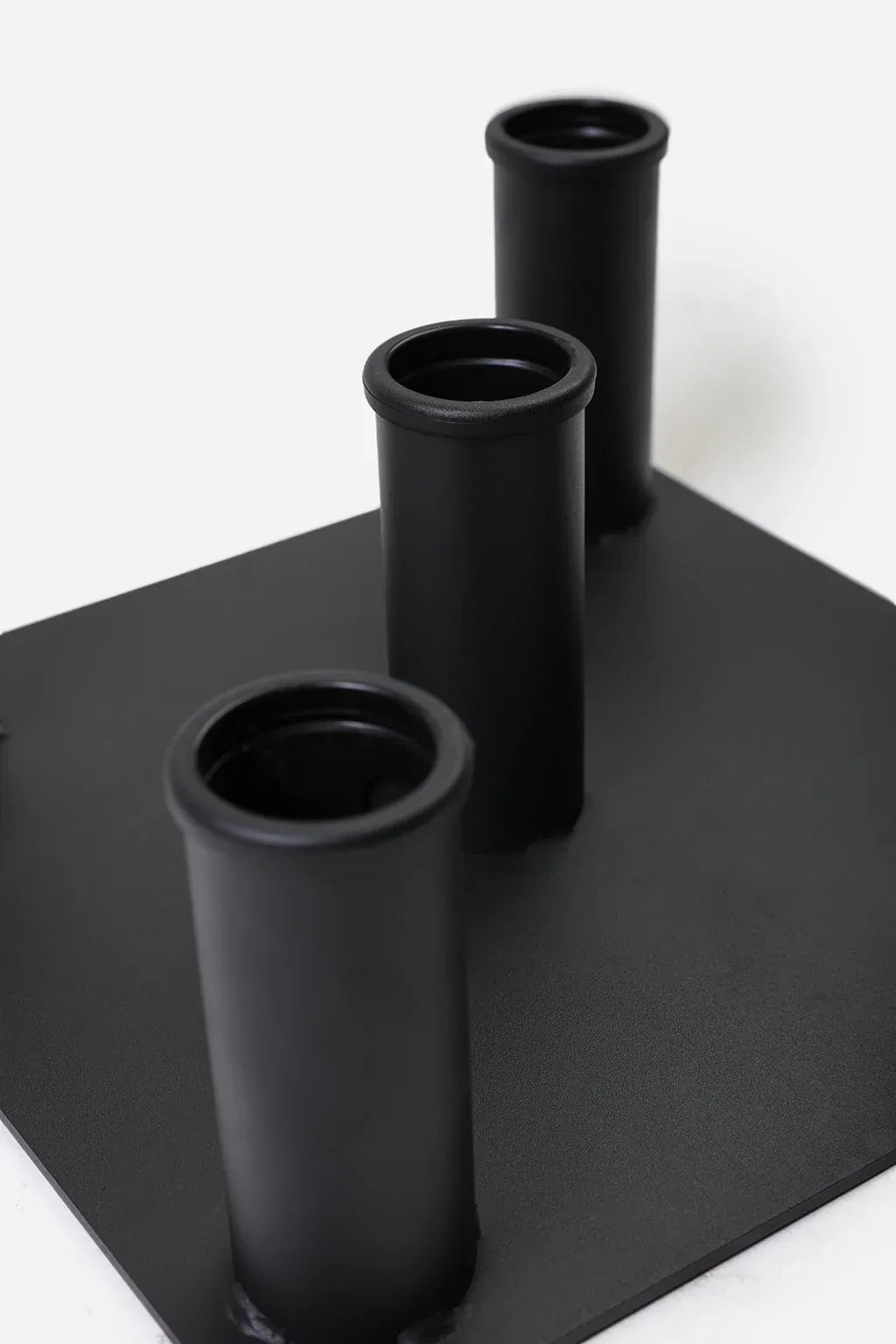 BlackBear Fitness 5 slot Olympic barbell floor stand close up showing steel storage tubes