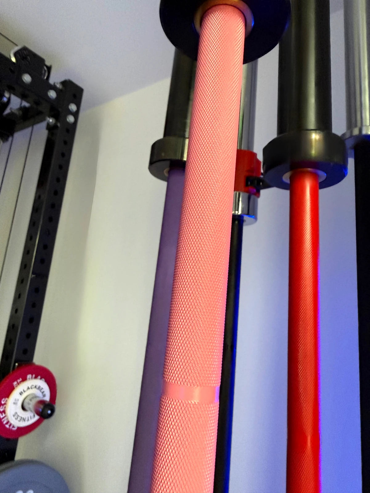 BlackBear 6ft 15kg Pink and Black Barbell — knurl and shaft detail close-up