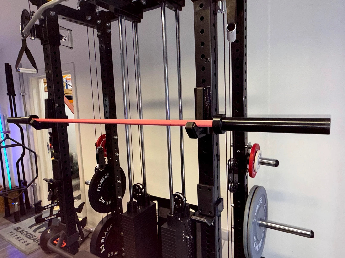 BlackBear 6ft Pink Olympic Barbell — lifestyle shot in gym setting