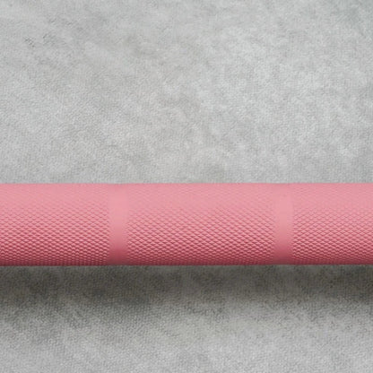BlackBear 6ft Pink and Black Olympic Barbell — sleeve loading end studio view