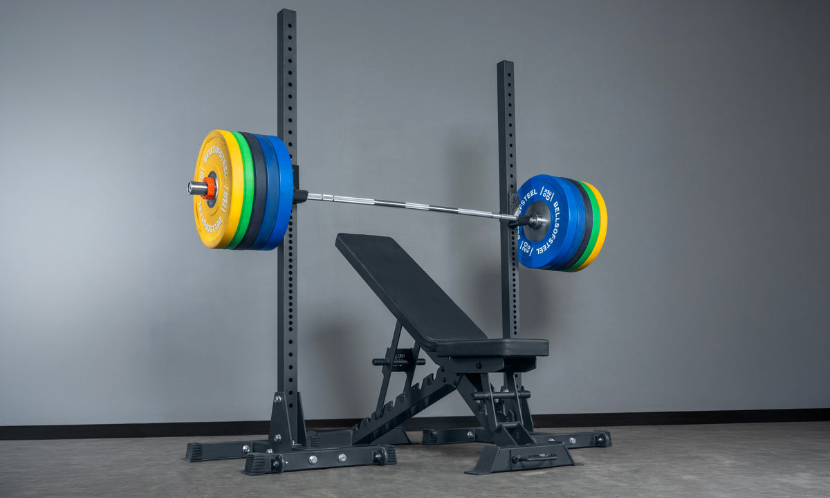 Bells of Steel adjustable bench set up with a barbell and weight plates