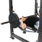 Bench press setup inside the Hydra rack with optional safeties