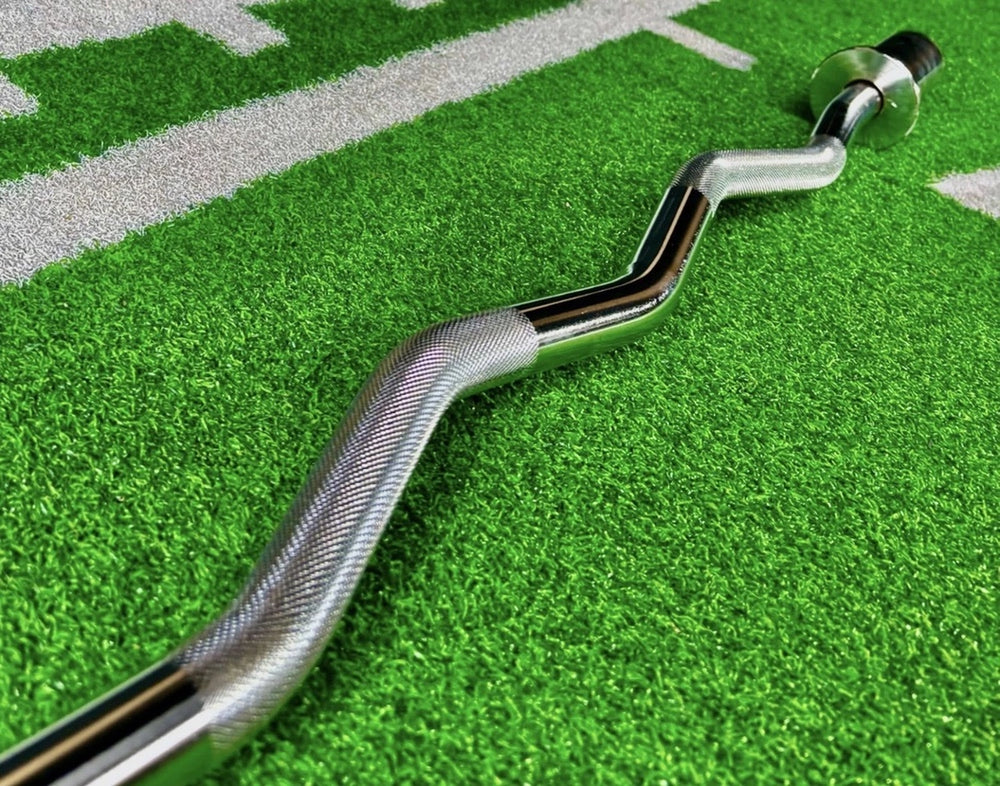Chrome EZ curl bar angled shaft and knurled grip close-up on gym turf