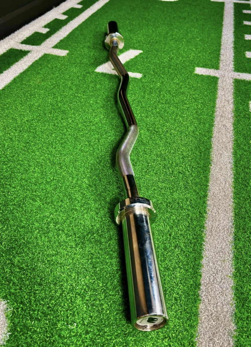 Chrome EZ curl bar sleeve and angled shaft shown lengthways on gym turf